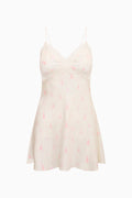 Pink mini slip dress with lace-trim V neckline and spaghetti straps