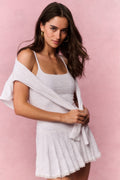 True white eyelet mini dress with fitted bodice and tiered skirt