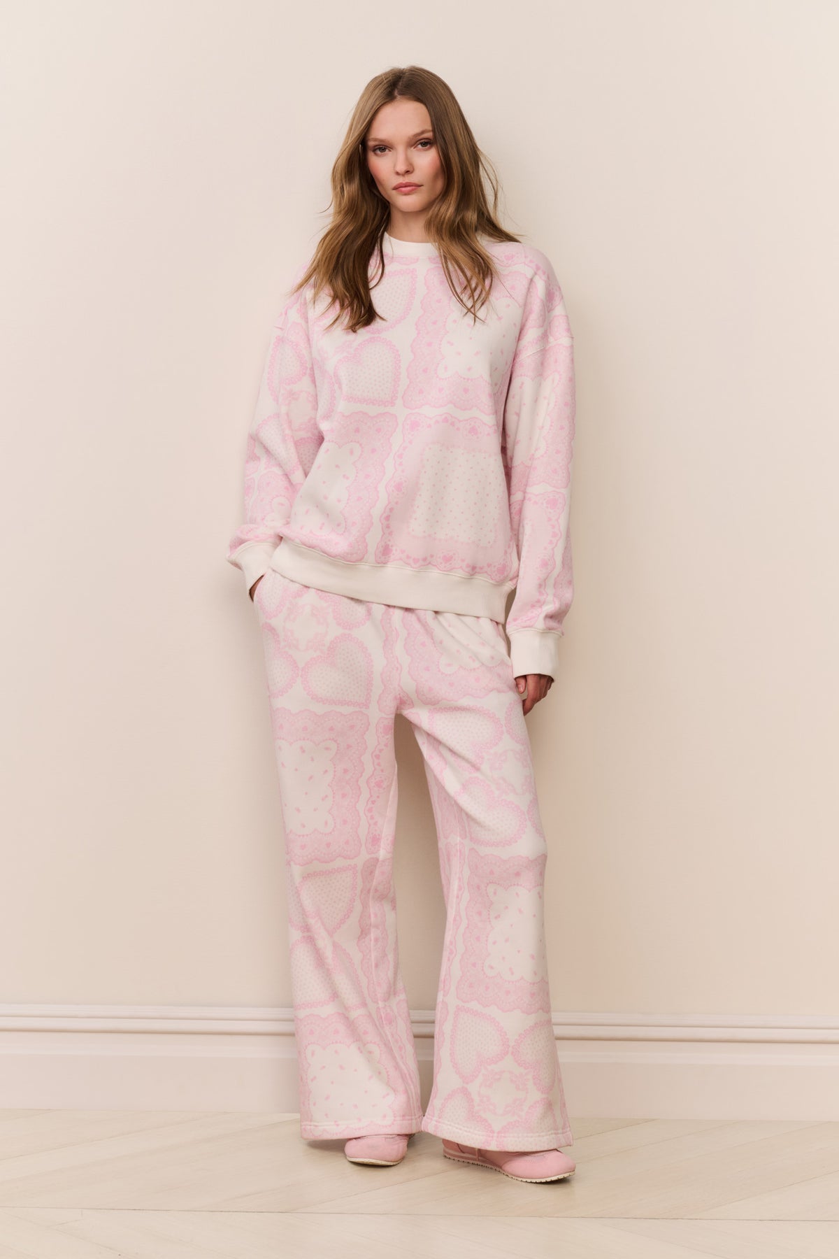 Pink heart-print fleece pullover with matching wide-leg pants, crew neck