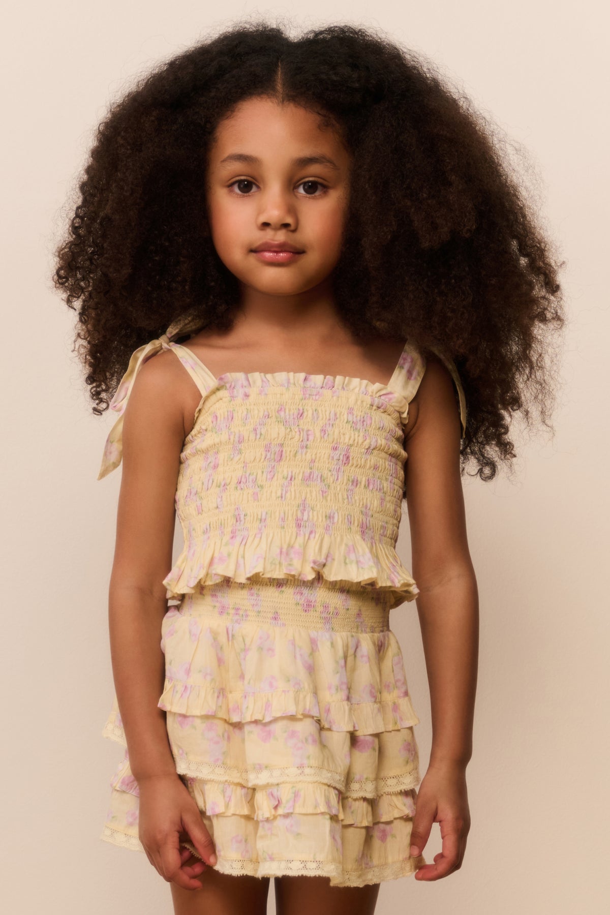 Girls light-yellow floral tiered ruffle top with smocked bodice and bow straps