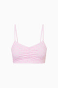 Pink patterned sports bra with thin spaghetti straps and ruched bust