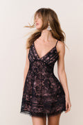 Black lace mini dress with V-neckline, spaghetti straps and gathered bodice