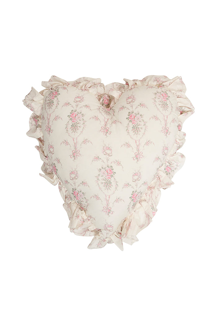 Heart-shaped ruffle pillow with blush floral print and layered ruffled edge