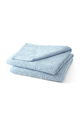 Light blue pointelle throw blanket with folded edges