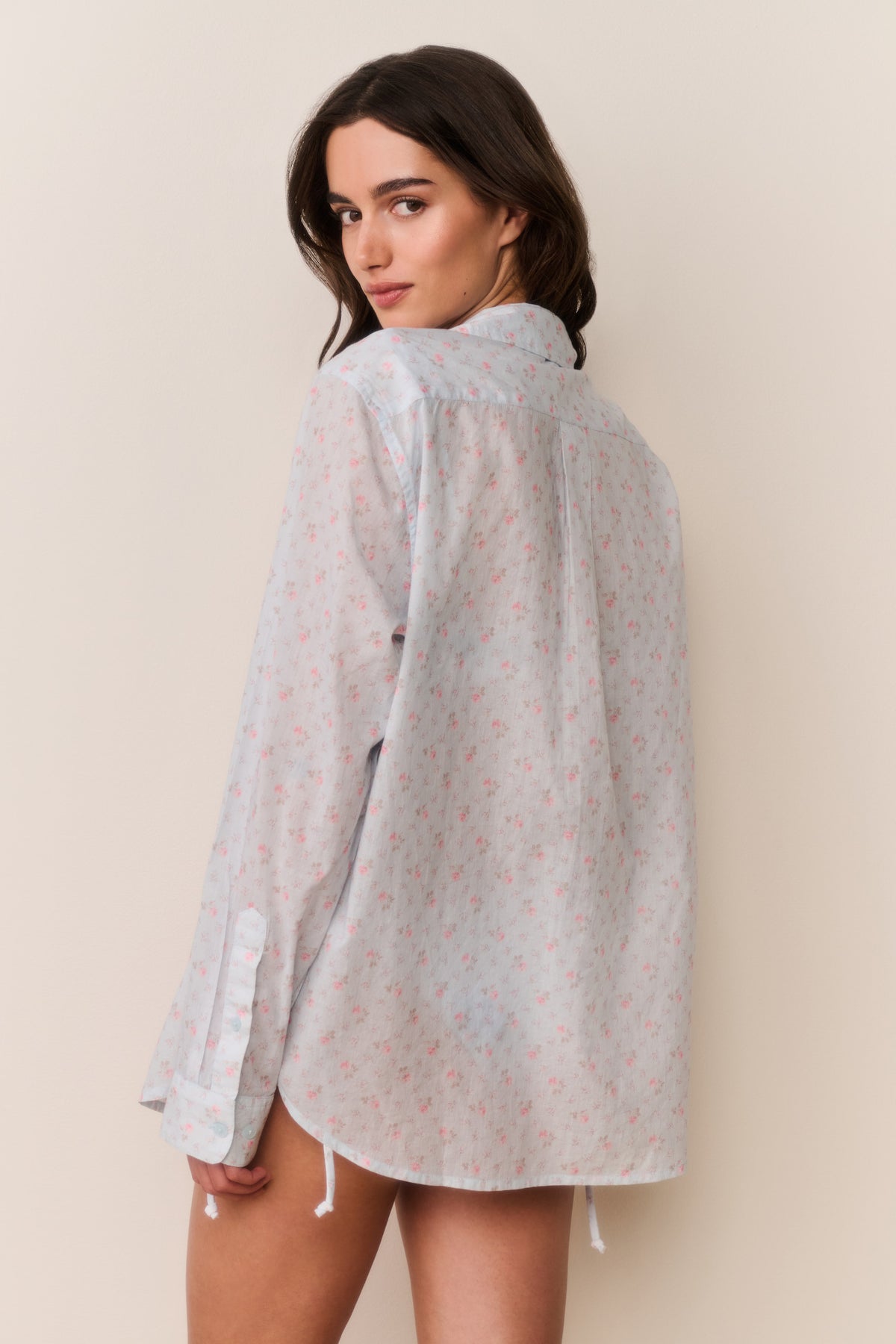 Unisex floral cotton shirt in light blue, long sleeve back view with curved hem