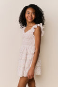 Ivory floral cotton dress with gathered waist and tiered ruffle hem, front view