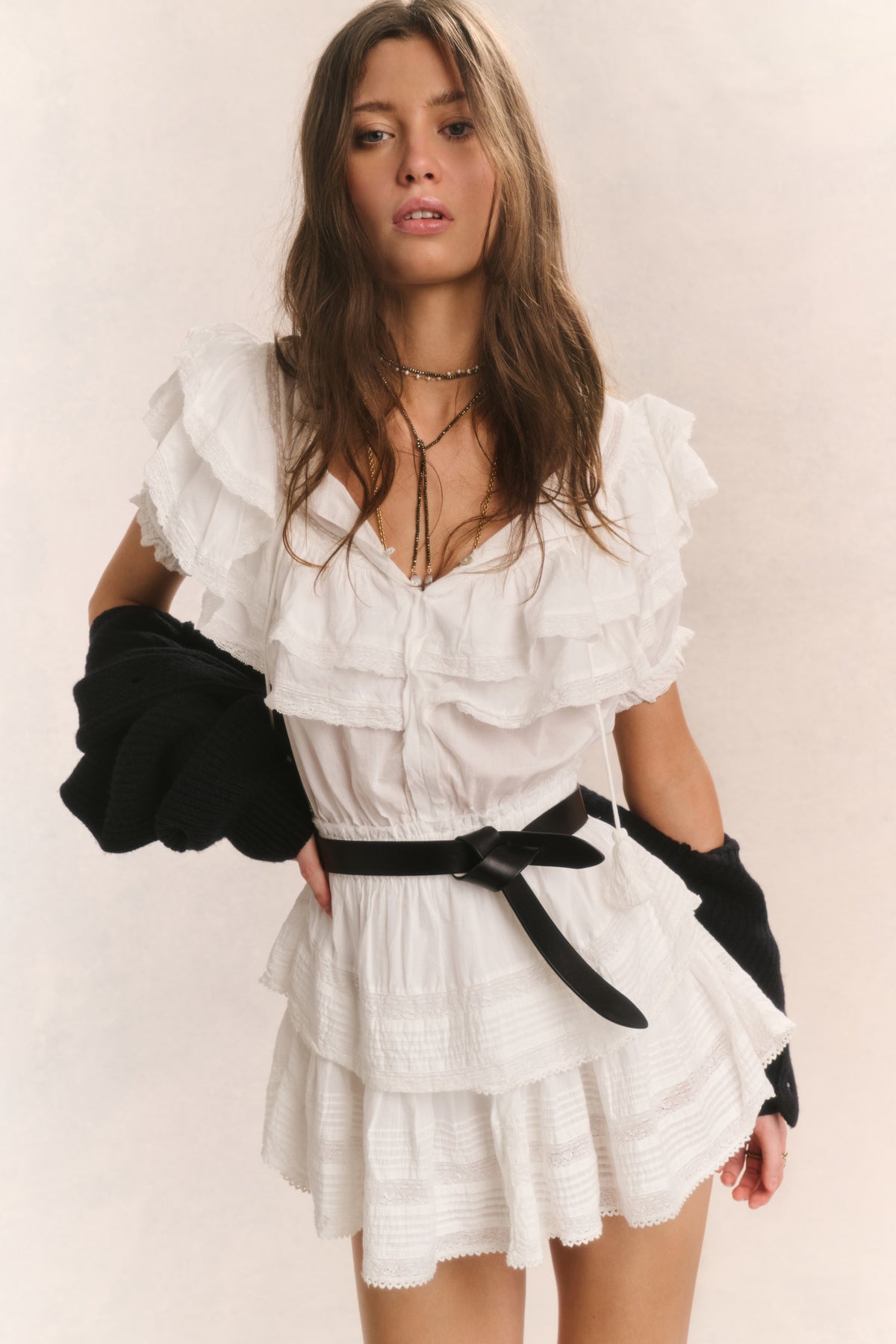 Antique white ruffled cotton mini dress with V-neck and tiered skirt, short sleeves