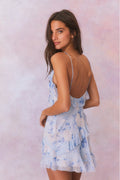 Light blue floral print silk mini dress with spaghetti straps and ruffled tiers