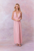 Pink floral print halter maxi dress with ruched bodice and tiered skirt