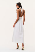 White linen halter maxi dress with open back tie and V halter neckline.
