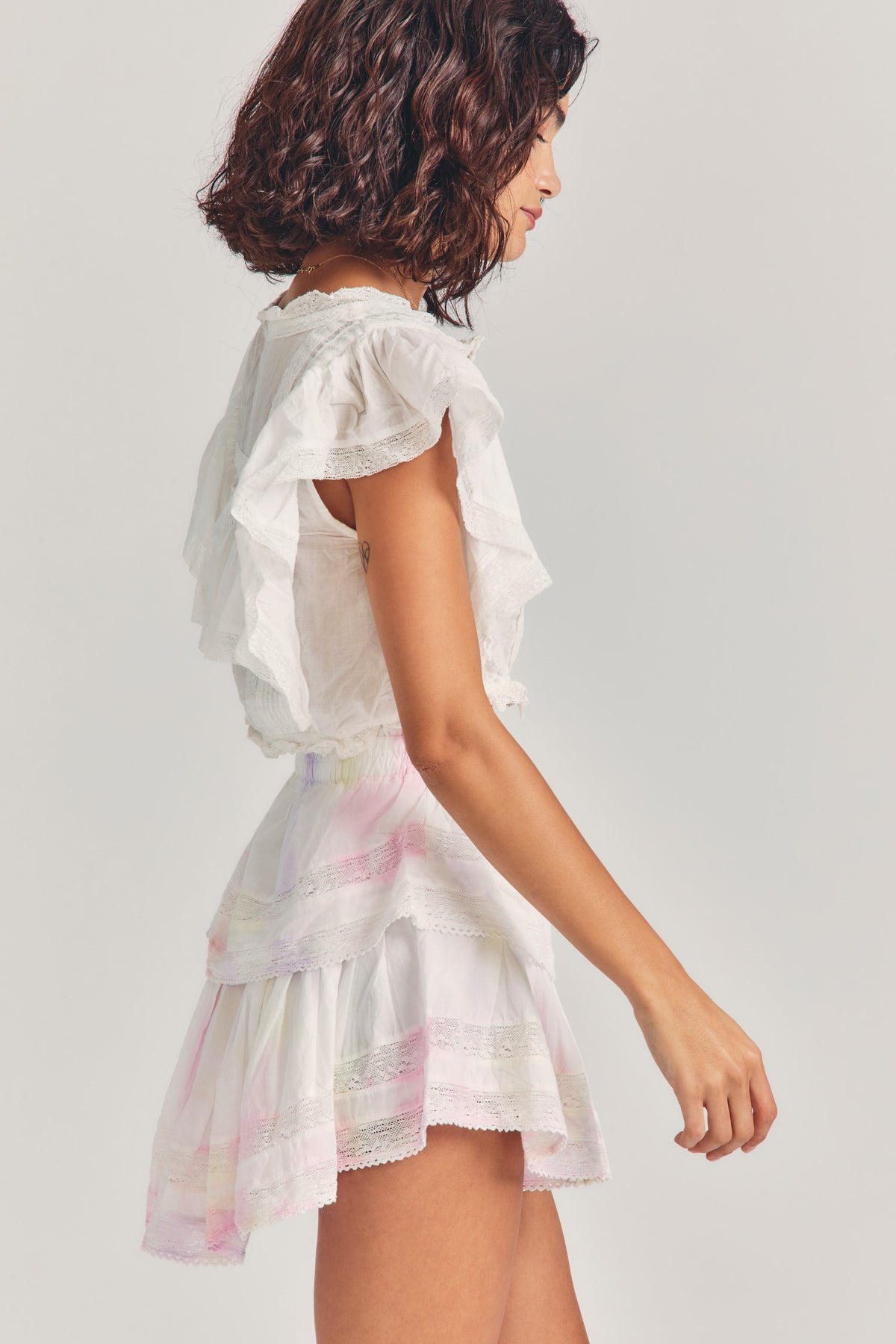 Ruffle mini heritage skirt in white with pastel stripes, tiered ruffles and lace edge