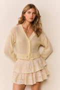 Tiered ruffle mini skirt in pale yellow with small floral print, tiered hem