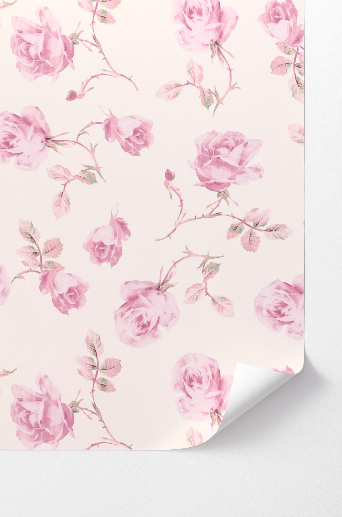 Pink rose peel-and-stick wallpaper with soft floral pattern, corner curl visible