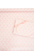 Pink gift wrapping paper with delicate bow and floral line pattern