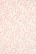 Light pink gift wrap paper with repeating bow and floral line design