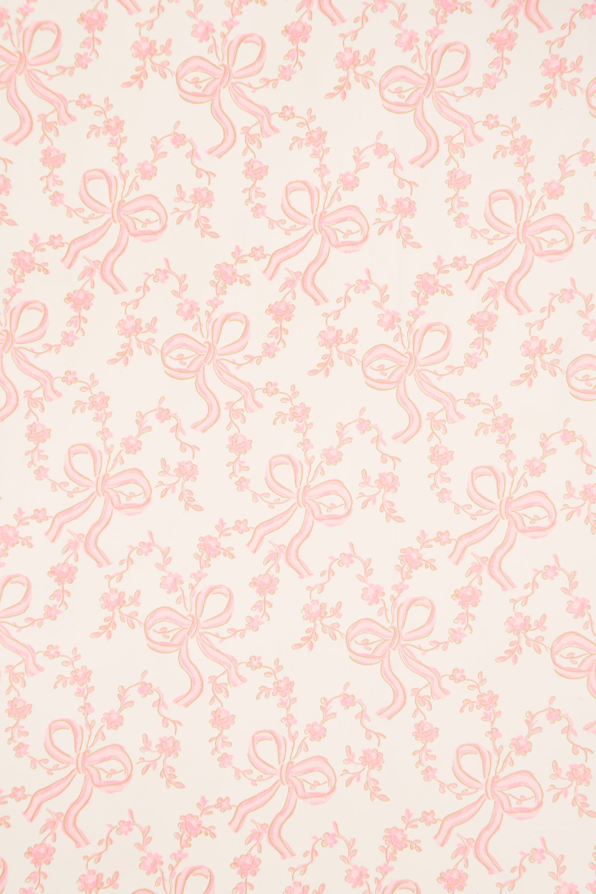 Light pink gift wrap paper with repeating bow and floral line design