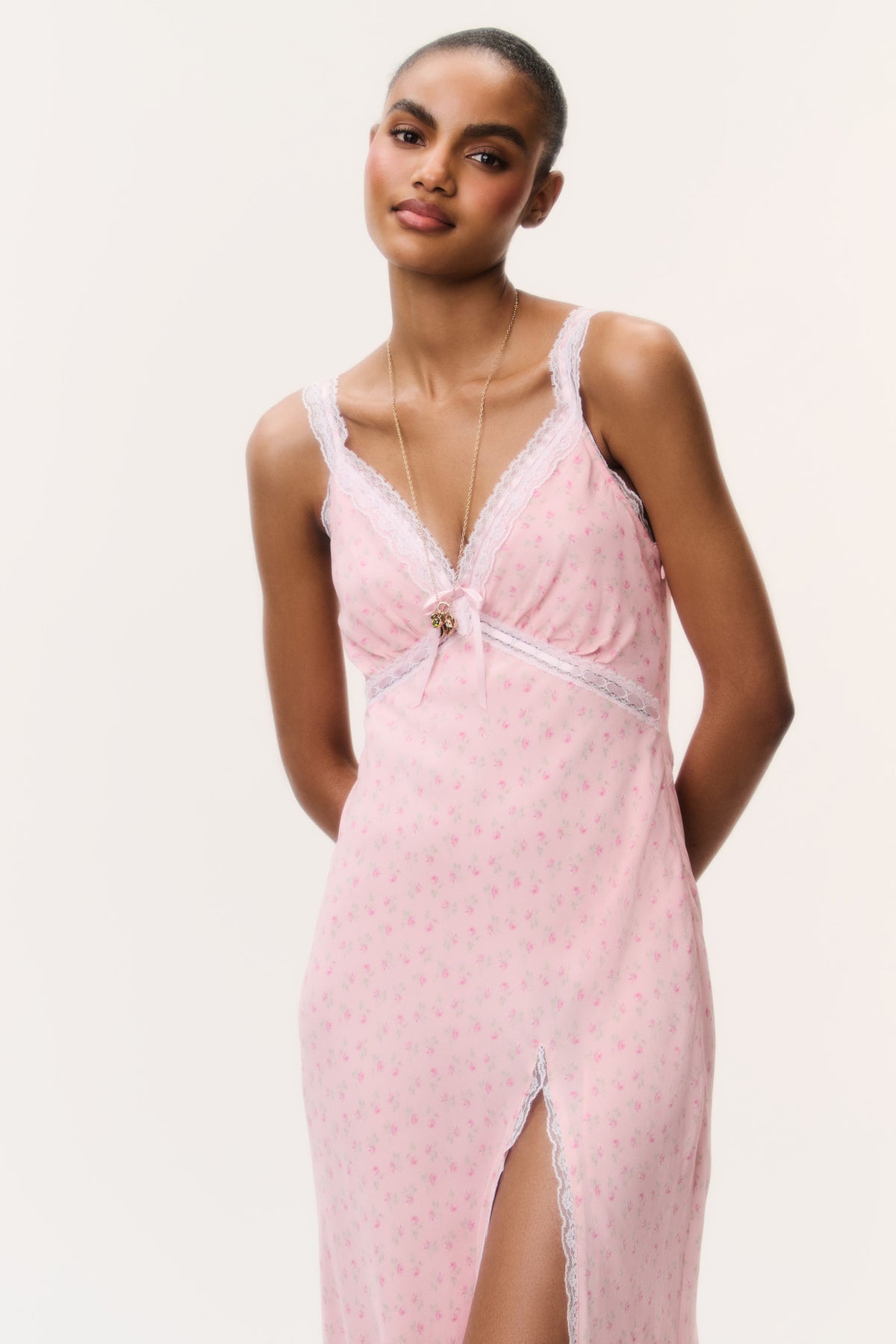 Pink floral V-neck maxi dress with spaghetti straps, center front tie detail, lace trim