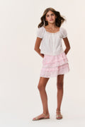 Pink tiered ruffle mini skirt with ditsy floral pattern and elastic waist
