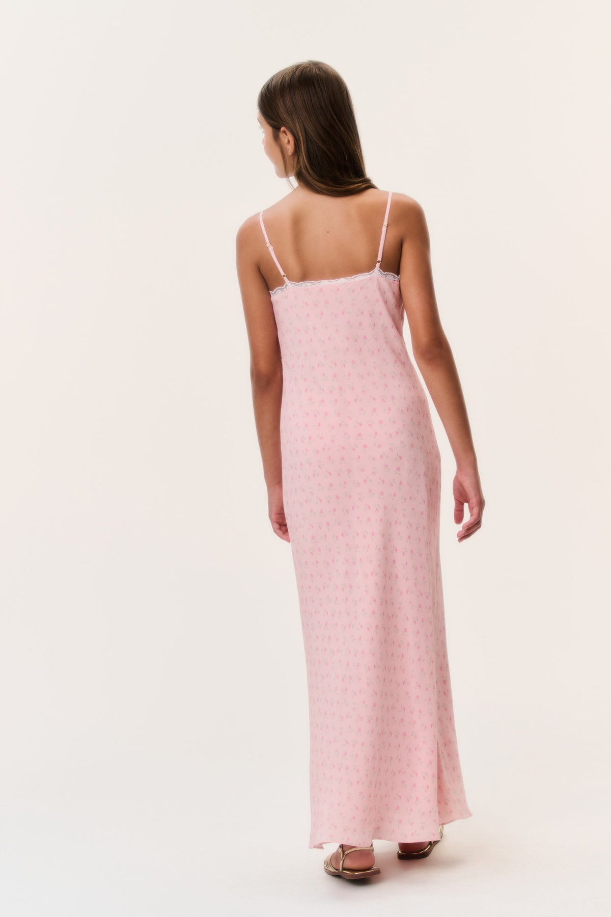 Tween floral crepe dress in light pink, back view with thin spaghetti straps and long hem