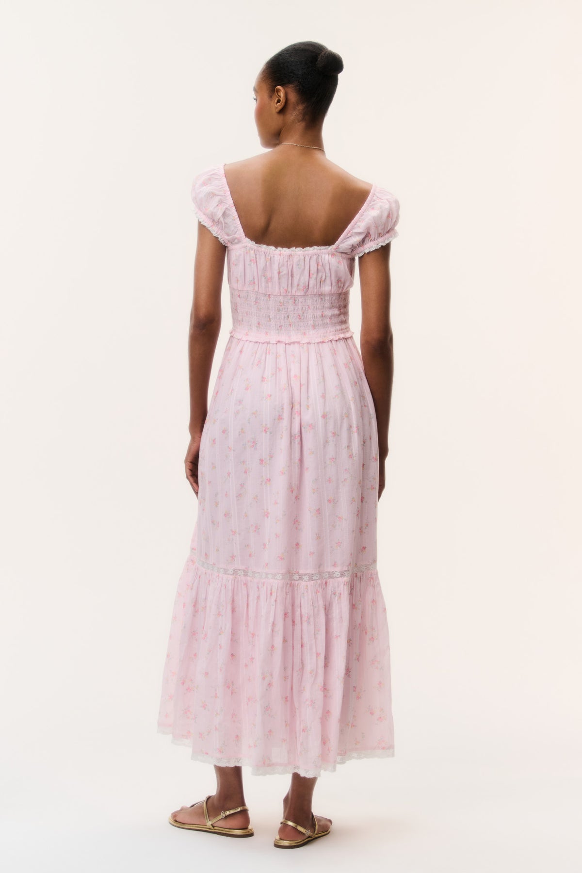 Pink floral cotton maxi dress, back view with smocked yoke and tiered hem