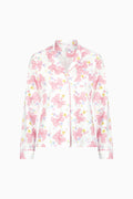 Women's long-sleeve pajama top in pink-and-white bow print with button front