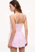 Back view of pink active dress with thin straps and ruffled hem