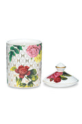 White ceramic candle jar with matching floral lid and rose-pattern design