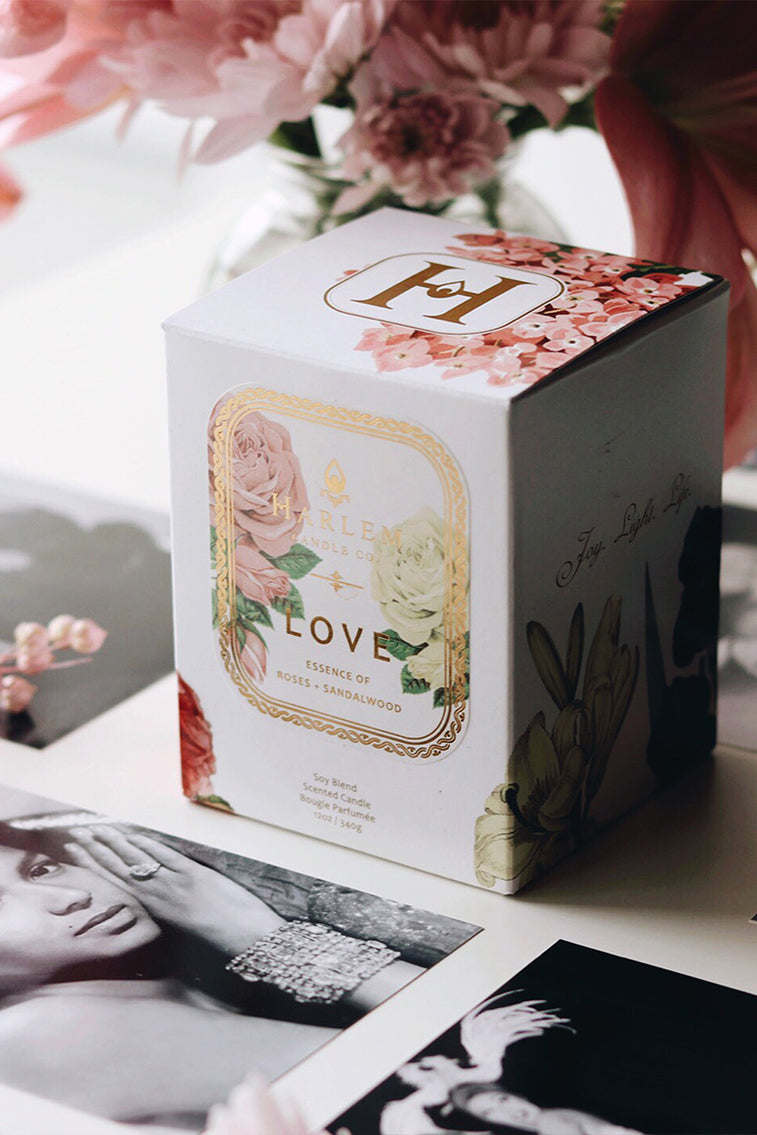 White candle gift box with decorative floral label and Love text