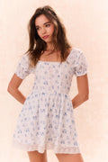 Girls light blue floral dress with short puff sleeves and flared skirt
