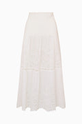 White cotton eyelet midi skirt with tiered panels and scalloped hem