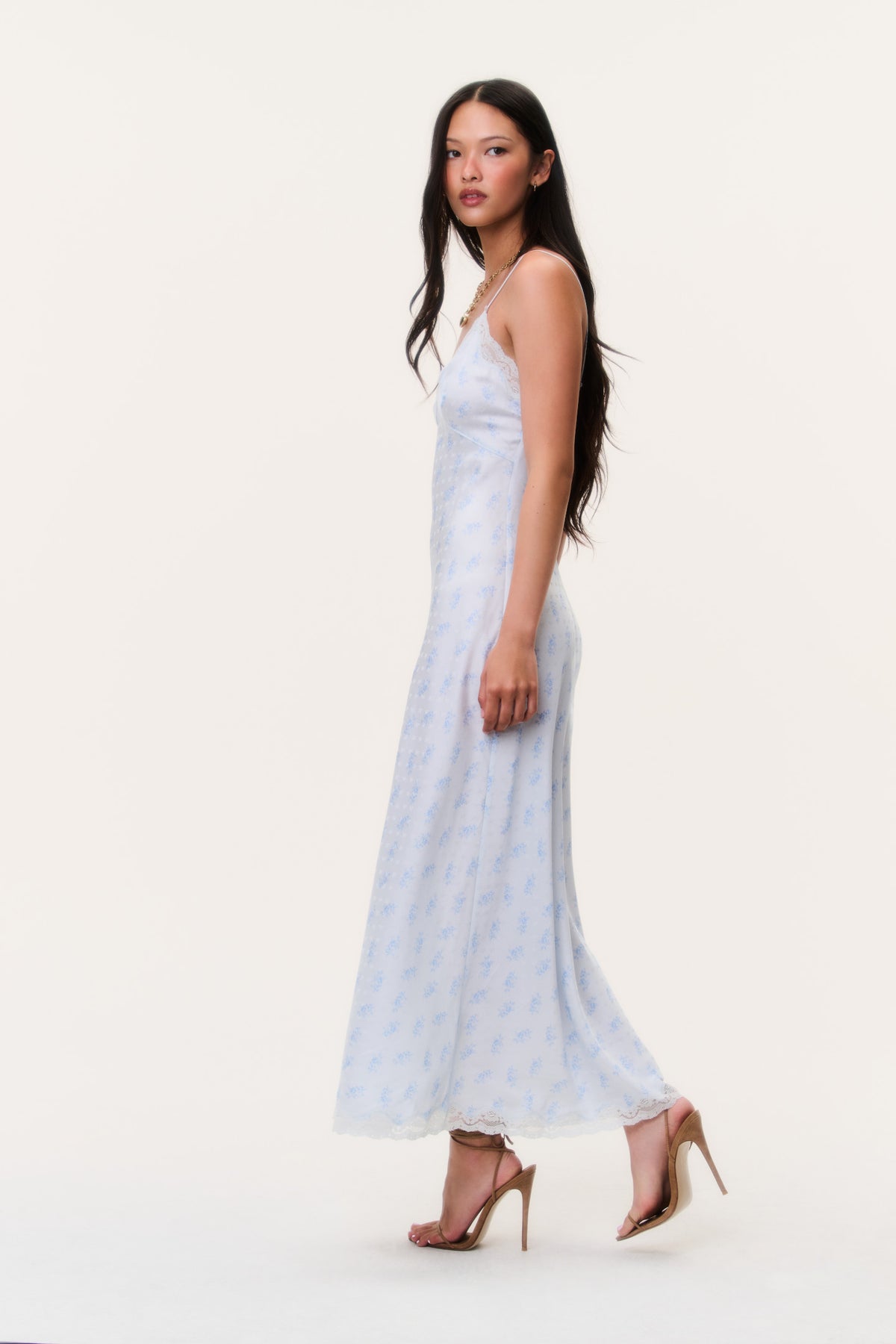 Light blue maxi slip dress with spaghetti straps, lace-trim neckline, side view