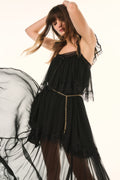 Black silk chiffon maxi dress with thin straps, lace trim, and gold chain waist