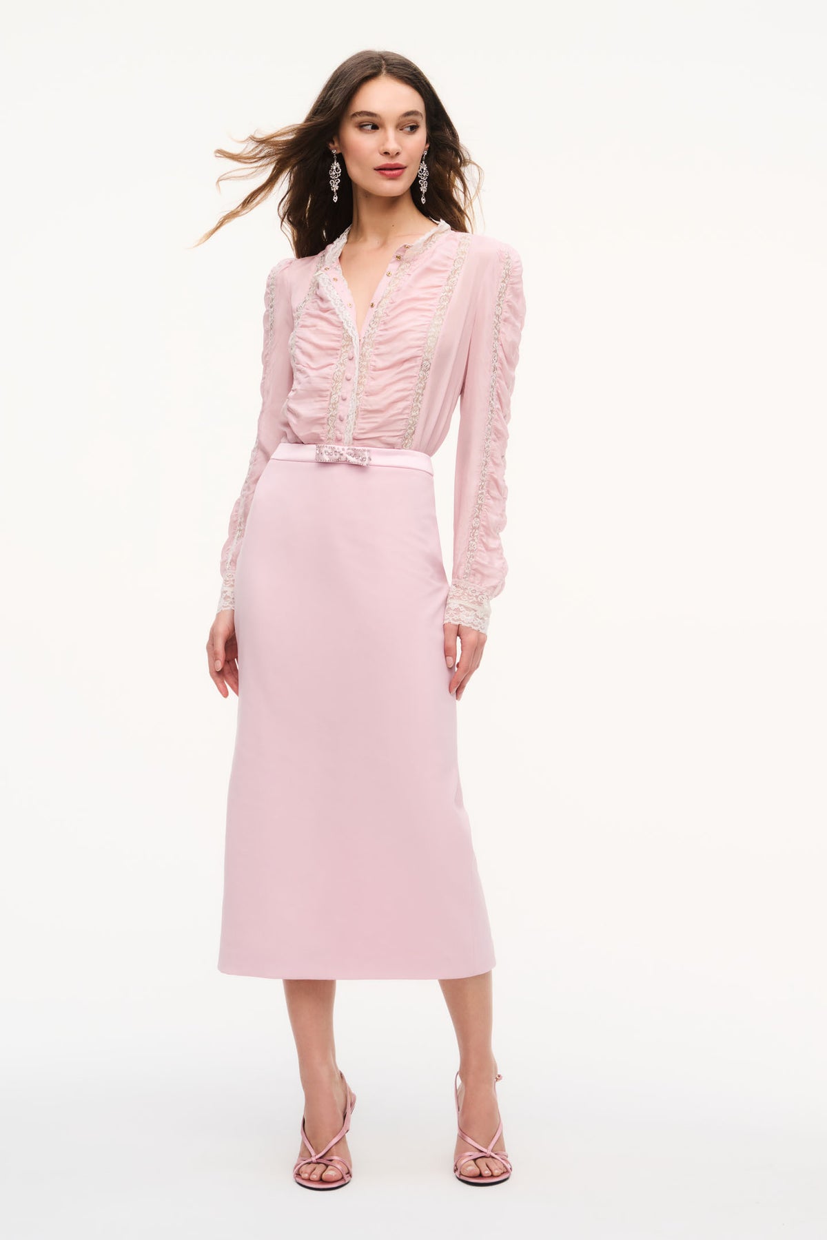Pink silk lace blouse with gathered front placket and long sleeves, paired with skirt
