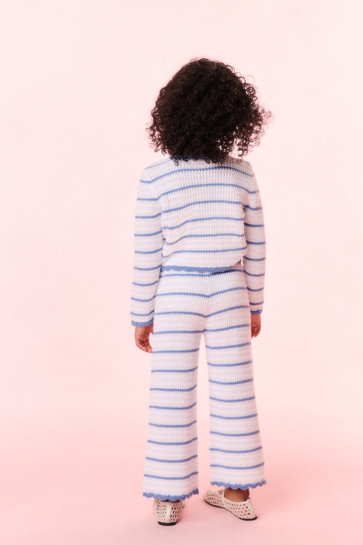 Girls striped crochet cardigan back view, light blue and white stripes, ribbed hem