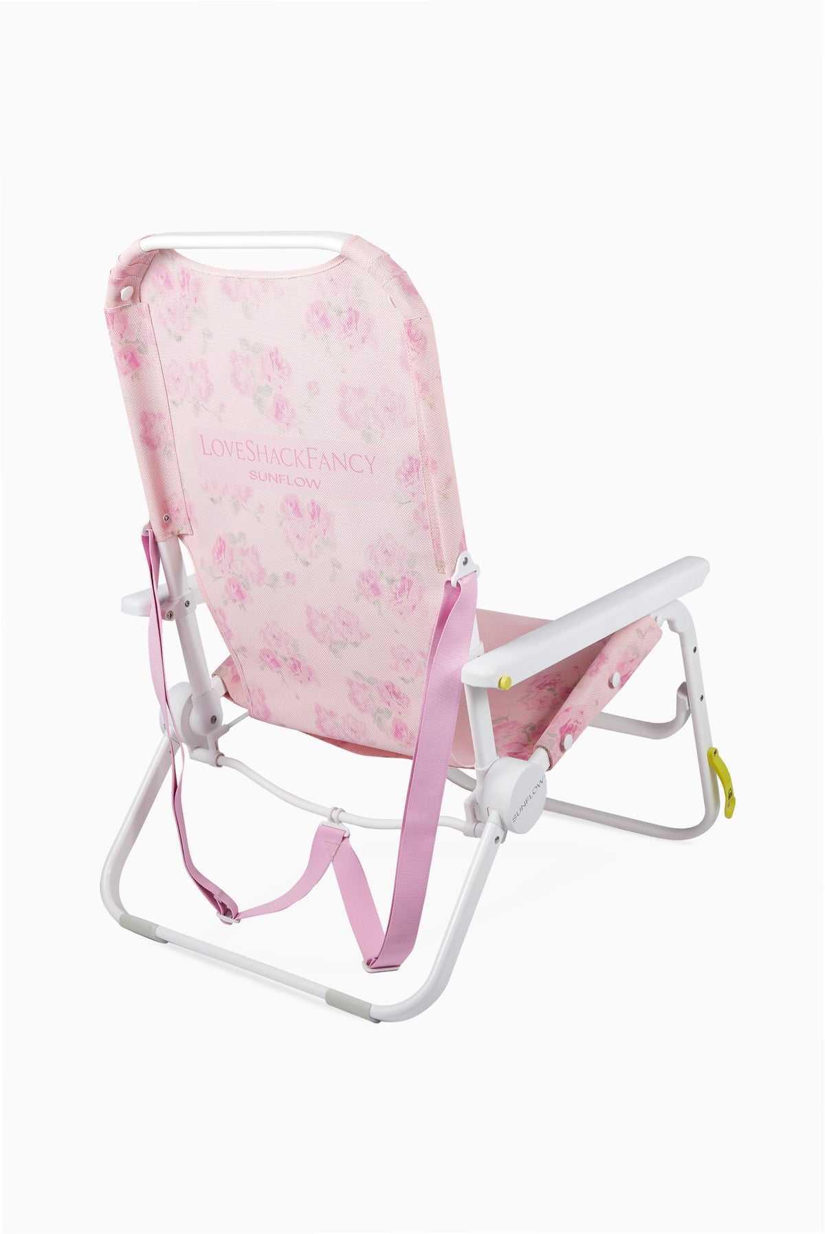 Pink floral ikat beach chair with white frame and front carry strap