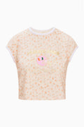 Cream floral ringer tee with white crew neck trim and centered team graphic