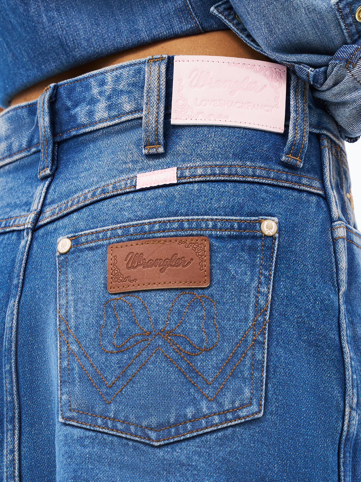 Denim mini skirt back pocket with Wrangler logo patch and signature stitching
