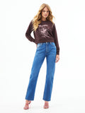 Medium wash cowboy cut jeans with belt loops, zip fly, and flared cuffs