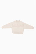 Cream mockneck crew sweatshirt with subtle pink dotted lettering at center