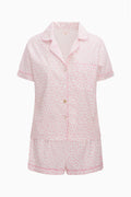 Pink patterned polo pajama short set with button-up top and matching shorts