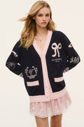 Wool varsity cardigan in navy with pink V-neck, button-front, and bow-heart embroidery