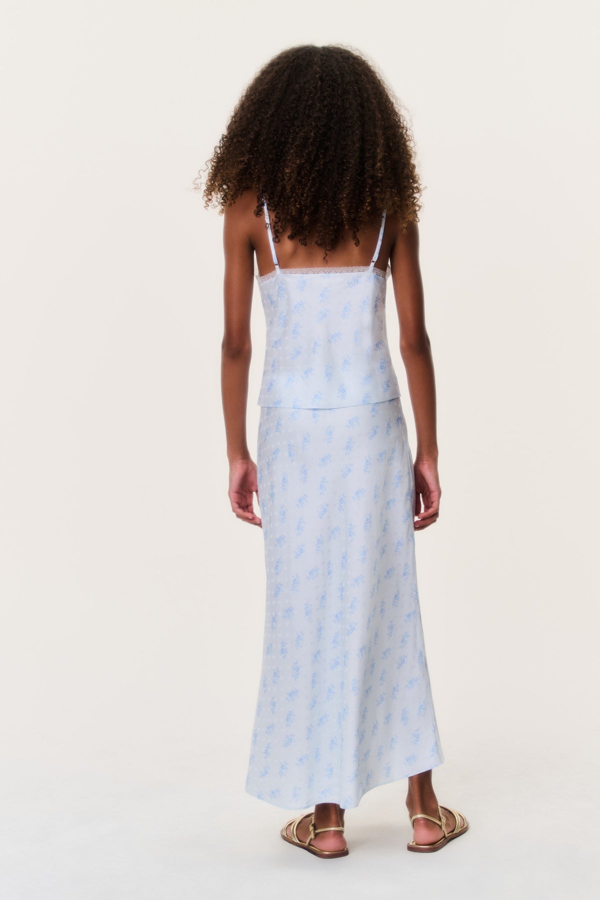 Tween silk-blend cami top back view, light blue patterned fabric with thin shoulder straps