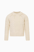Girls cream Mavita pullover with cable knit texture, crew neck, long sleeves, ribbed cuffs and bow details at the neck