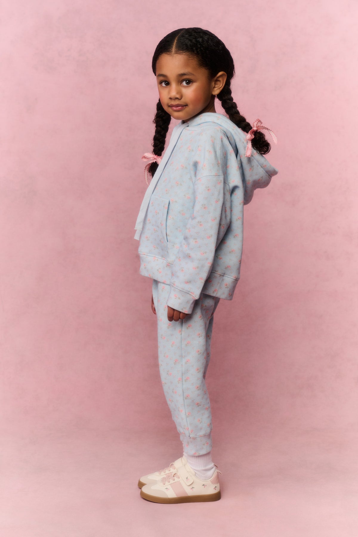 Girls floral light-blue sweatpants, side view, cuffed legs and drawstring waist