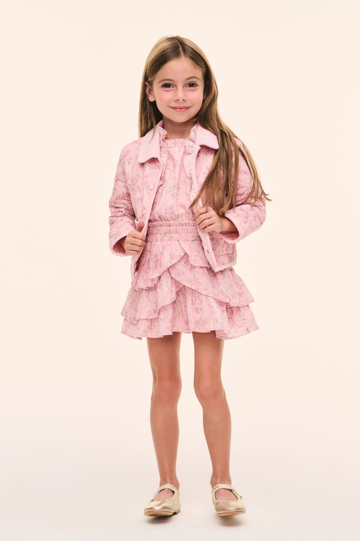 Girls' pink quilted jacket with floral texture, button closure, and cropped hem