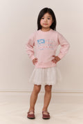 Girls' pink crewneck pullover with colorful front graphic, lace skirt and mary jane shoes