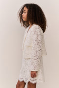 Ivory lace jacket with front button placket and long sleeves, side view