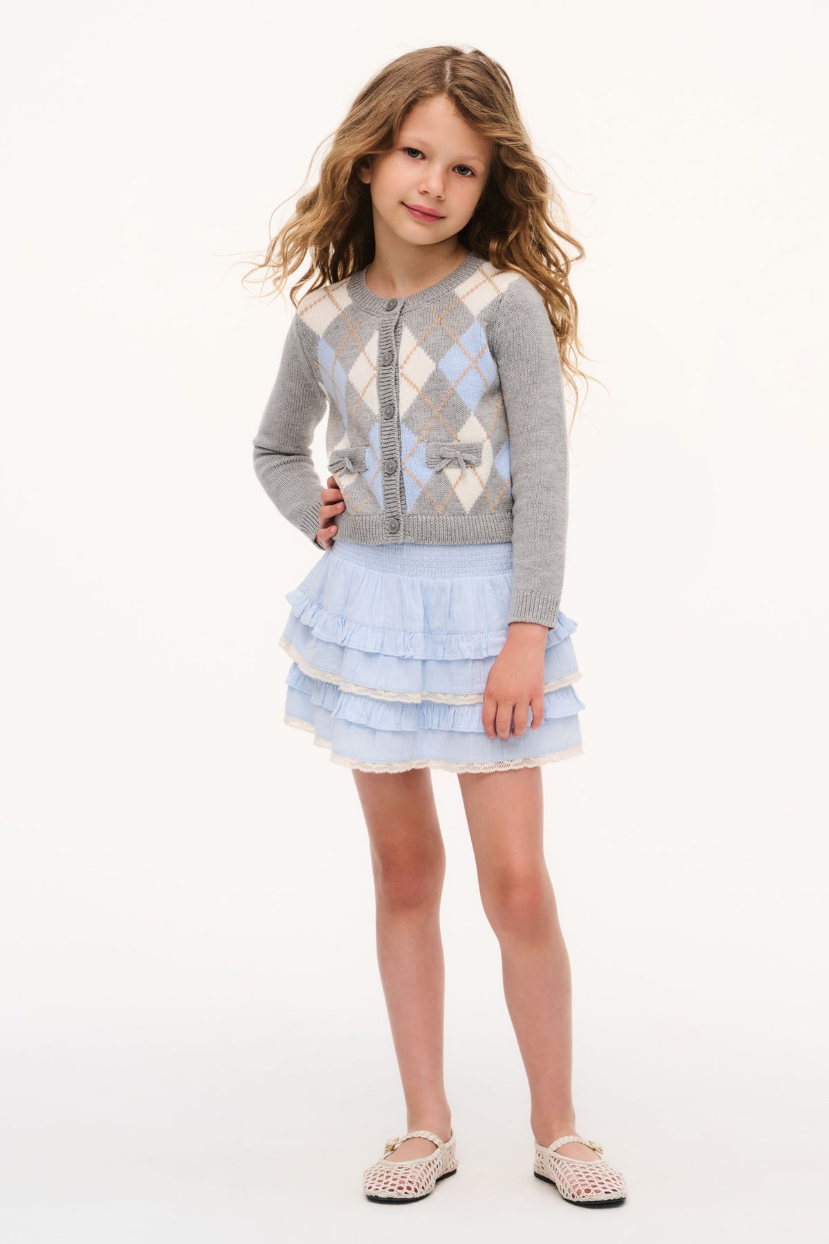 Light blue tiered ruffle skirt with elastic waist, worn by child