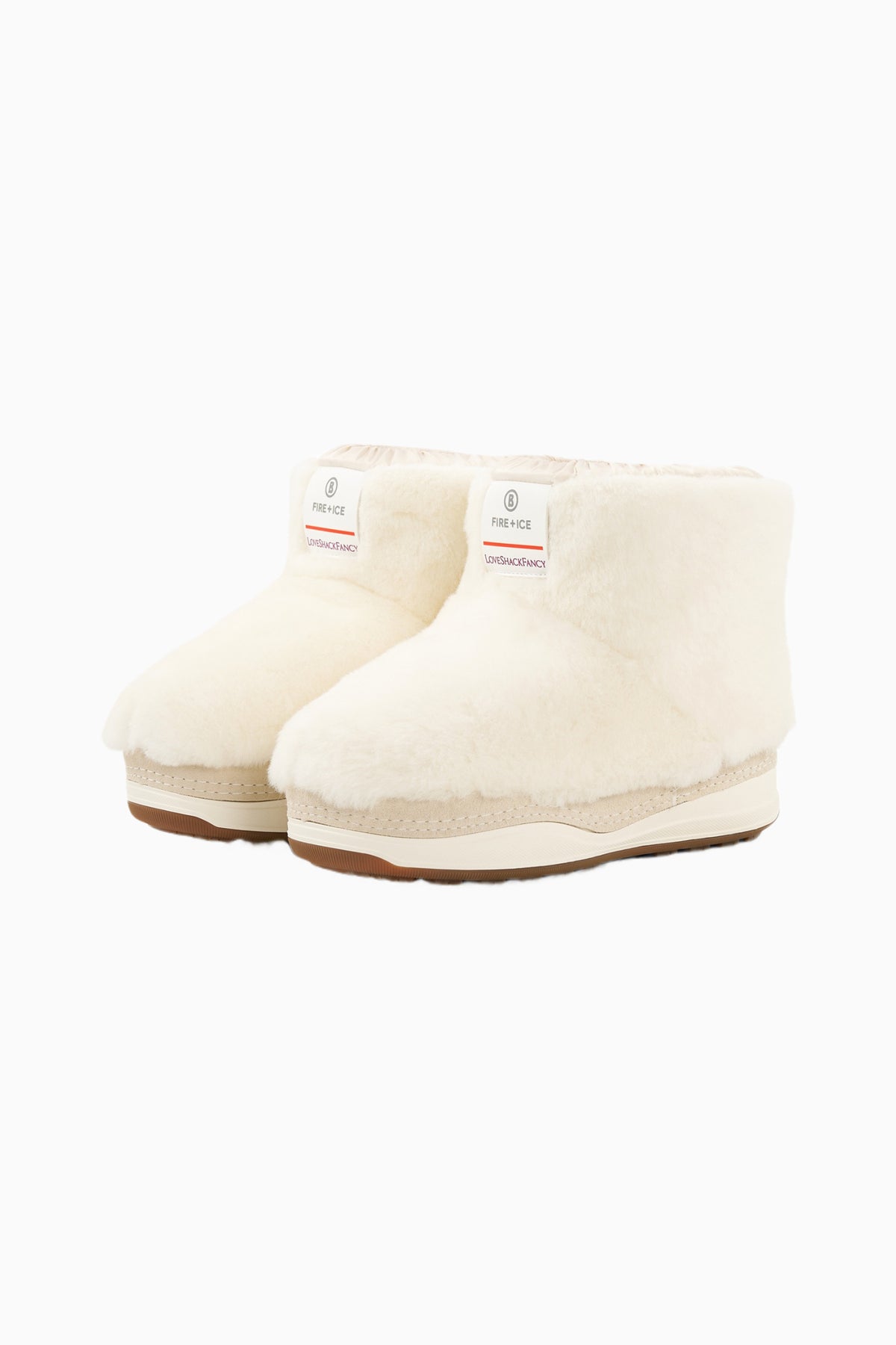Off-white faux-fur girls boots with cuff stitching and brown rubber sole