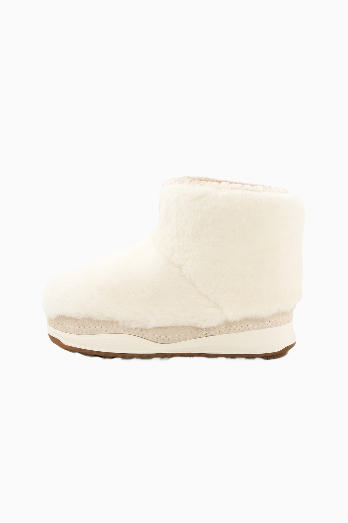 Off-white girls ankle boot with plush upper and brown outsole edge